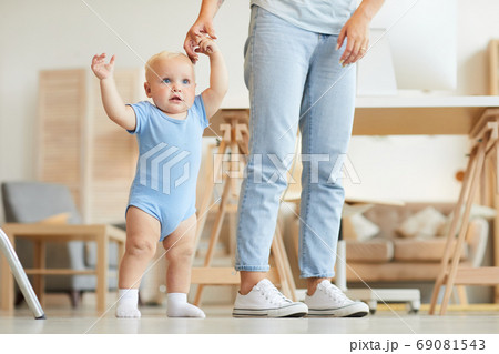 Mother Holding Hand Of Toddler 69081543