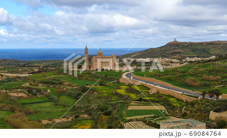 Aerial view over Basilica Ta Pinu in Gozo - a national shrine Aerial view over Basilica Ta Pinu in Gozo - a national shrine 69084764