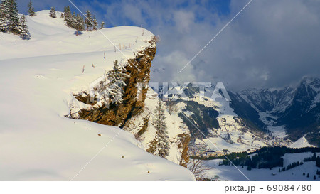 Flight over a snowy mountains in winter - wonderful Swiss Alps 69084780