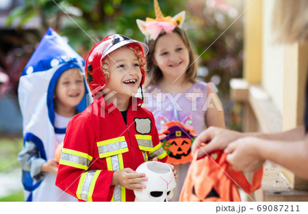 Kids trick or treat. Halloween fun for children. 69087211