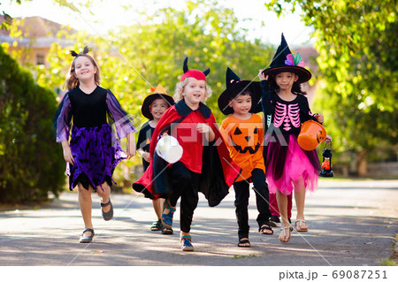 Kids trick or treat. Halloween fun for children. 69087251