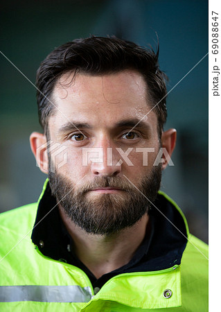 Portrait of male Engineer standing with confident against machine environment in factory Portrait of male Engineer standing with confident against machine environment in factory 69088647