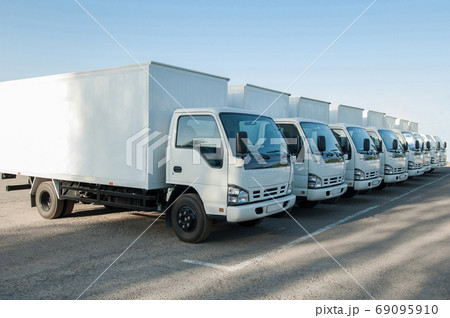 trucks stand in the parking lot in a row trucks stand in the parking lot in a row 69095910
