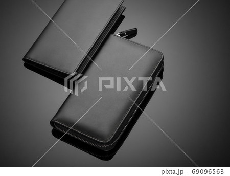 men's wallet on a black background 69096563