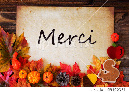 Old Paper With Merci Means Thank You, Colorful Autumn Decoration Old Paper With Merci Means Thank You, Colorful Autumn Decoration 69100321