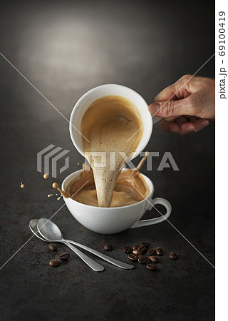 Coffee pouring splash Coffee pouring splash 69100419