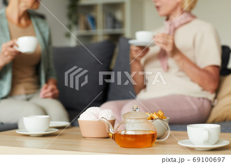 Drinking tea with friend Drinking tea with friend 69100697