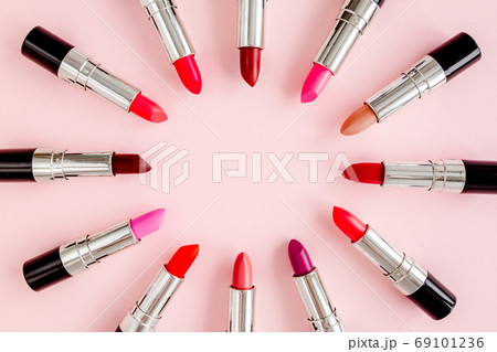 Set of color lipsticks on pink background. Professional decorative cosmetics, product pomade. Flat composition beauty, fashion. flat lay, top view 69101236