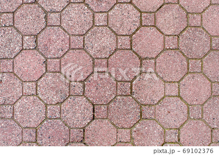 road paved with brown sidewalk tiles. texture of light brown bri road paved with brown sidewalk tiles. texture of light brown bri 69102376