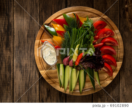 dish on a wooden surface dish on a wooden surface 69102890