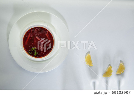 food in a dish on a white surface 69102907