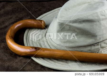 Walking Stick and Hat on Outdoor Coat 69105009