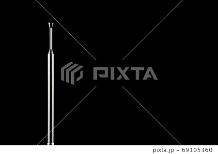Telescopic Radio Antenna on a Black Background 69105360