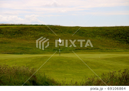 Golf Course Green and Flag Stick Golf Course Green and Flag Stick 69106864