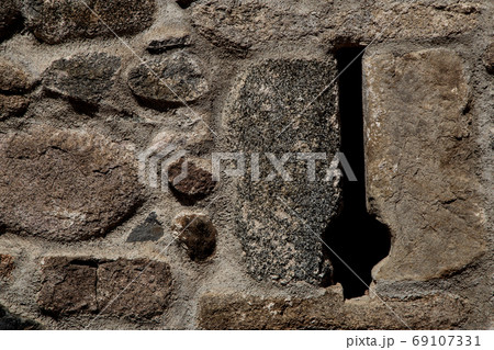 Stone Castle Wall With Arrow Slit Close Up Stone Castle Wall With Arrow Slit Close Up 69107331
