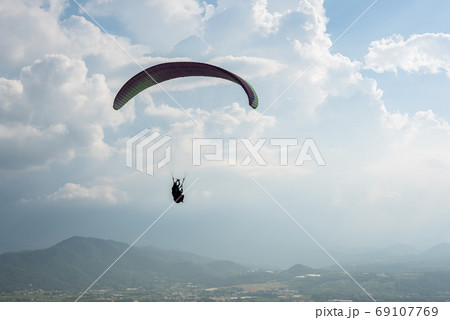 colorful paragliding over blue sky at town colorful paragliding over blue sky at town 69107769