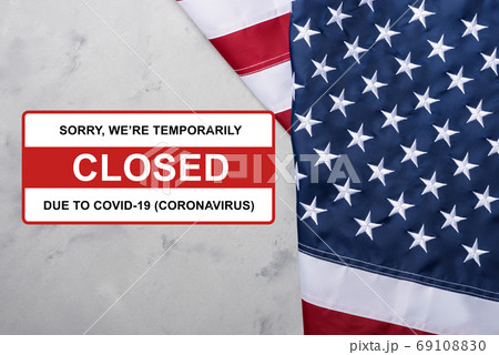 USA Flag of United States of America with sign closed due to Coronavirus Covid-19 sign USA Flag of United States of America with sign closed due to Coronavirus Covid-19 sign 69108830