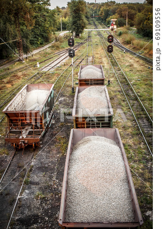 Freight cars with crushed stone on the railroad 69109556