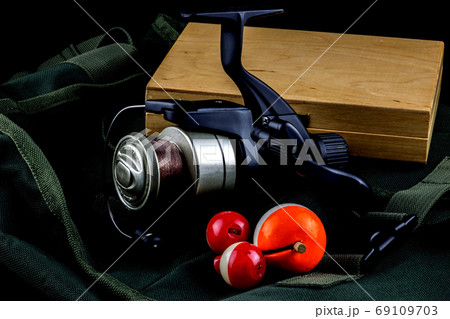 Fishing Reel with Floats and Tackle Box on Fishing Bag Fishing Reel with Floats and Tackle Box on Fishing Bag 69109703