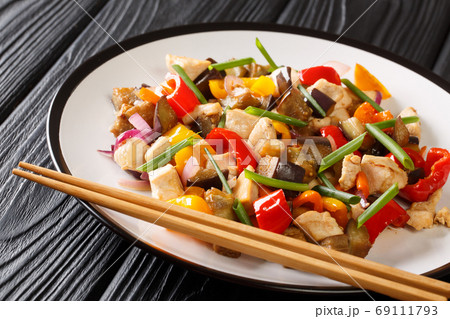 Asian food stir fried chicken with eggplant, pepper and onion in Asian food stir fried chicken with eggplant, pepper and onion in 69111793