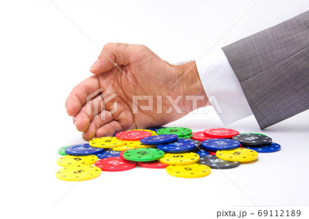 poker player taking a chip isolated on white background poker player taking a chip isolated on white background 69112189