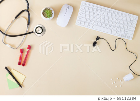 Doctor`s online consultation concept with computer and microphone Doctor`s online consultation concept with computer and microphone 69112284