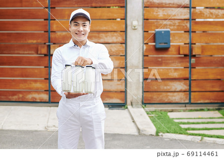 Milkman offering fresh milk 69114461