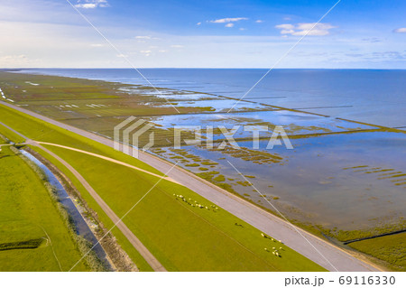 Aerial view sea dike Waddensea Aerial view sea dike Waddensea 69116330