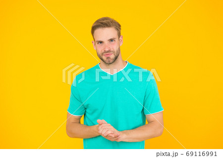 Handsome man yellow background. Well groomed guy Handsome man yellow background. Well groomed guy 69116991