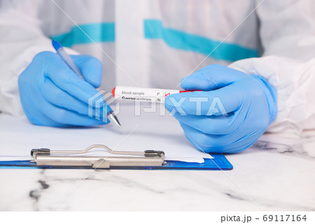 laboratory technician hand holding blood test tube laboratory technician hand holding blood test tube 69117164