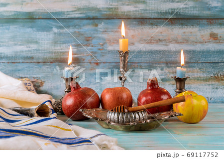 A jewish new year with honey for the apple and pomegranate holiday of Rosh Ha Shana 69117752