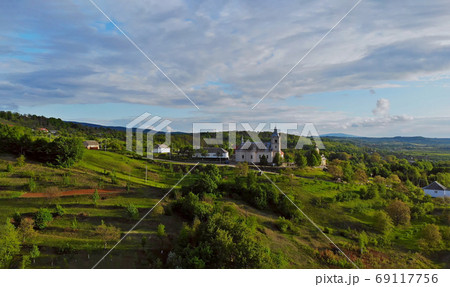 Landscape a small village in a mountainous area on a spring sunny day Karpaty Ukraine 69117756