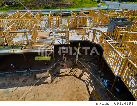 Wooden house frame structure on a new development 69124191
