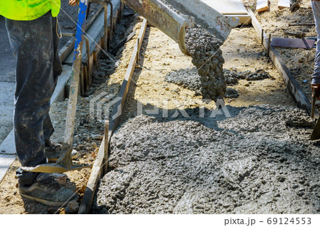 Construction worker pour cement for sidewalk in Construction worker pour cement for sidewalk in 69124553