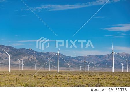 Sunny view of many windmill in a rural area Sunny view of many windmill in a rural area 69125538