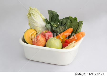 vegetables and fruits in white plastic bowl 69128474