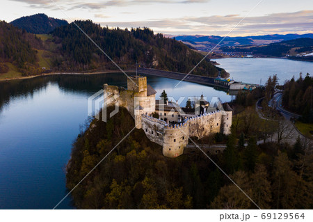 Nedzica castle near Chorshtynskoe reservoir at twilight Nedzica castle near Chorshtynskoe reservoir at twilight 69129564