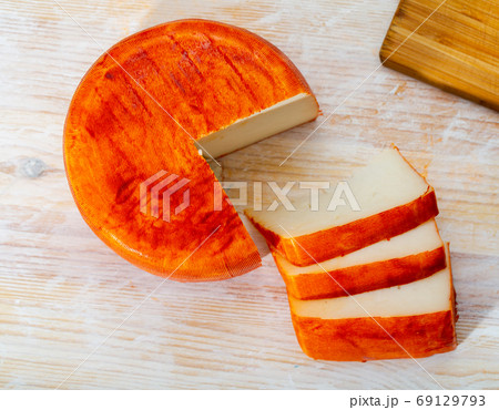Image of goat cheese with pepper on wooden desk 69129793