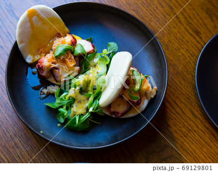 Bao with octopus and chutney from mango and bacon 69129801