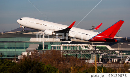Take off passenger plane in the sky. Airport Barcelona Take off passenger plane in the sky. Airport Barcelona 69129878