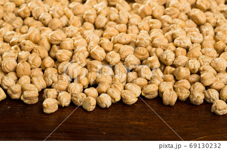 Raw cheakpea background on wooden surface, nutritious food 69130232
