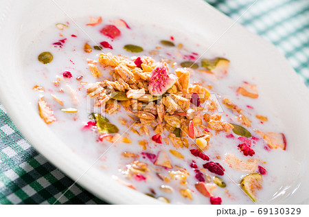 Cereals muesli with dried fruits and milk 69130329