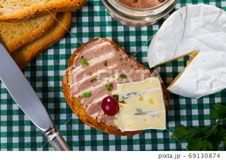 Toast with pate and soft blue cheese Toast with pate and soft blue cheese 69130874
