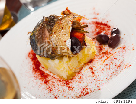 Rolls-up of fillet of mackerel with olives and rosemary Rolls-up of fillet of mackerel with olives and rosemary 69131198