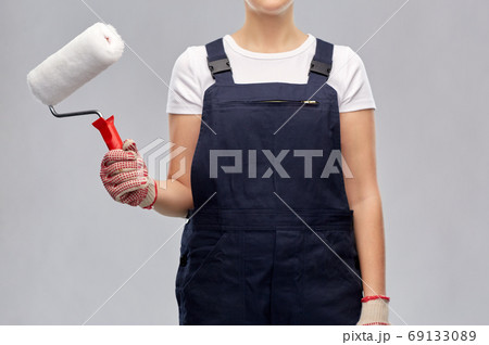 close up of painter or builder with paint roller close up of painter or builder with paint roller 69133089