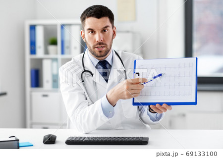 doctor with cardiogram having video call at clinic 69133100