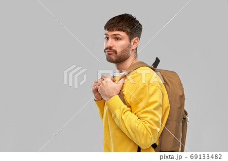 sad unhappy young man with backpack sad unhappy young man with backpack 69133482