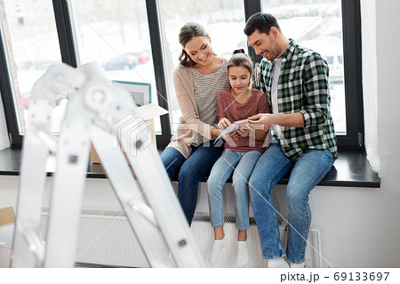 happy family with color palette moving to new home 69133697