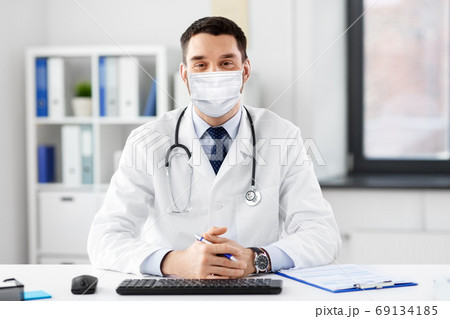 male doctor in medical mask at hospital male doctor in medical mask at hospital 69134185