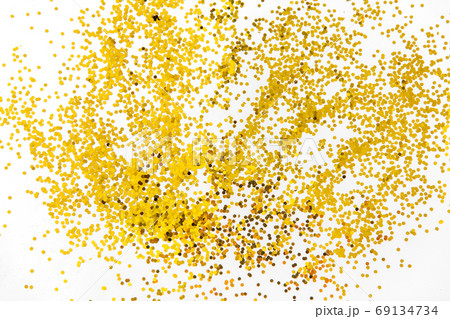 golden glitters on white background golden glitters on white background 69134734